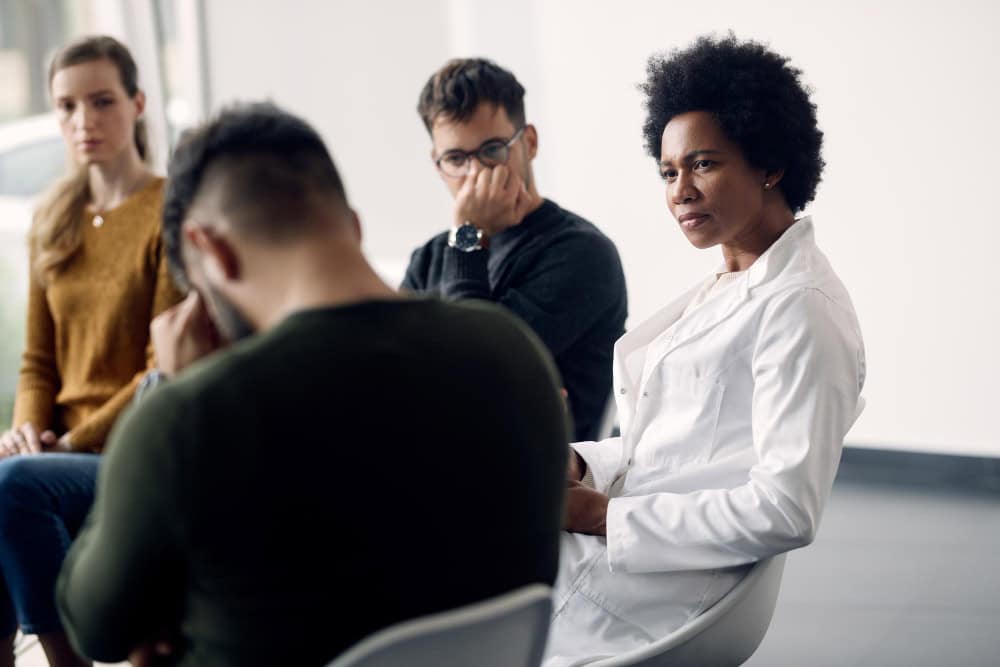 Therapist leading a group session as part of comprehensive individual therapy in Massachusetts at Brook Recovery Centers.
