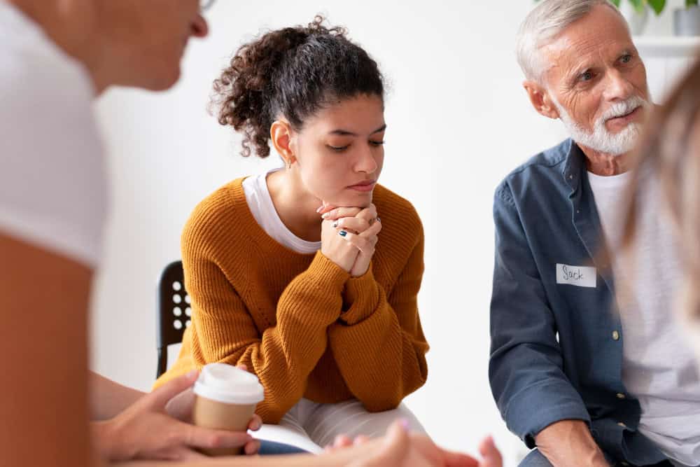 People gathering at a community center while participating in individual therapy in Massachusetts at Brook Recovery Centers.