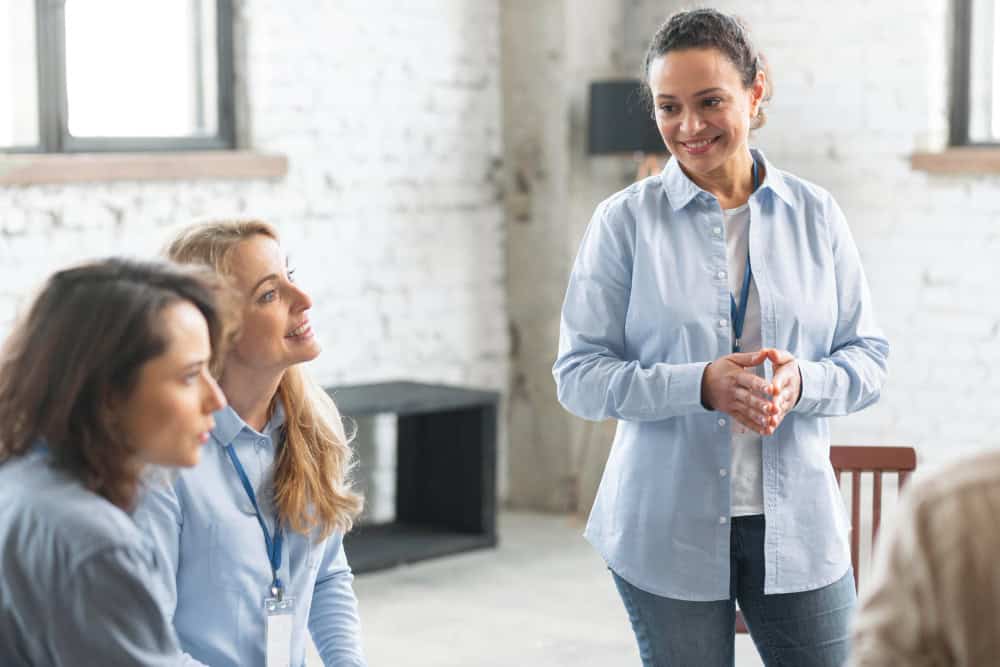 eople talking during therapy as part of executive drug rehab in Massachusetts at Brook Recovery Centers.