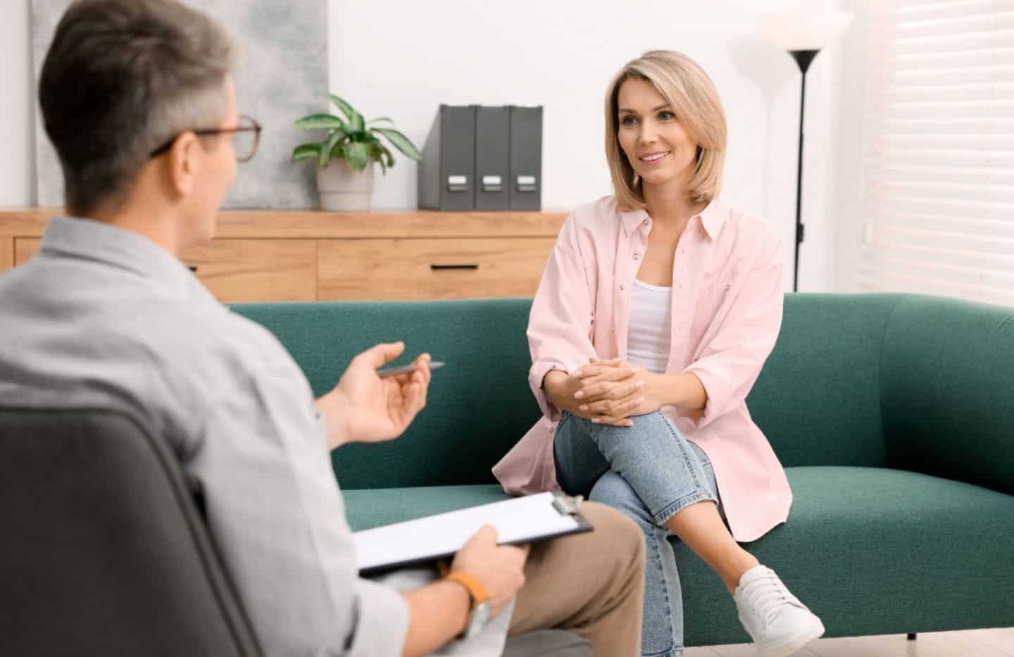 Woman in therapy during drug rehab for professionals in Massachusetts.