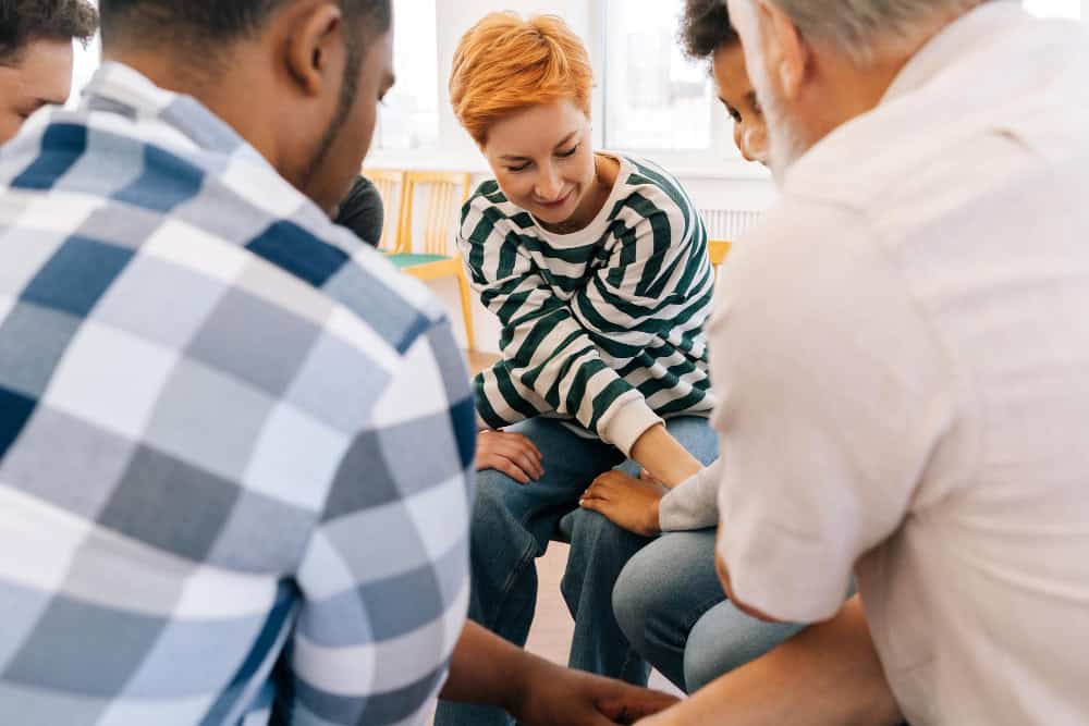 First responders supporting one another in a group therapy session during drug rehab for first responders in Massachusetts at Brook Recovery Centers.
