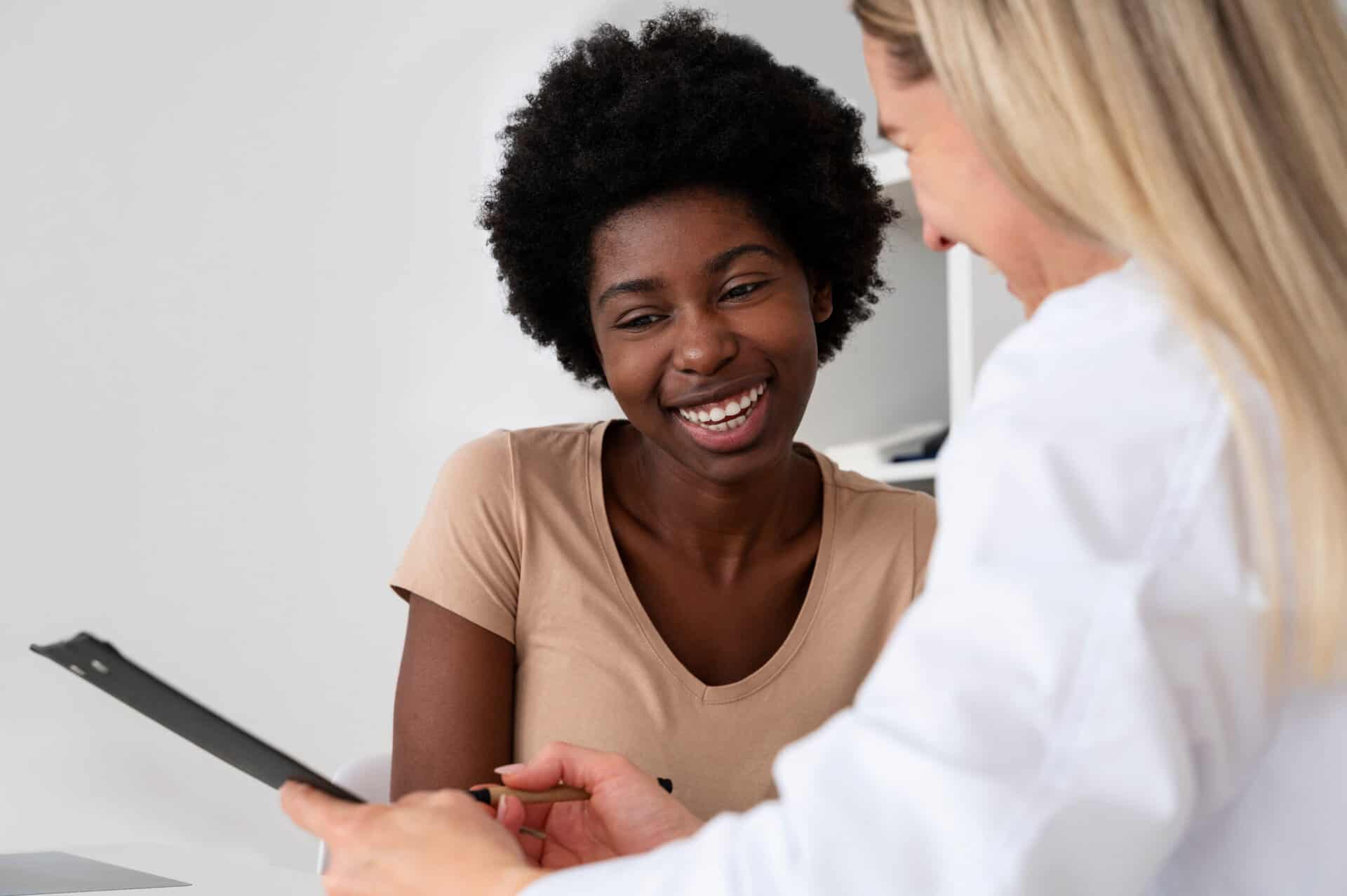 A woman talks to her doctor about options for rehabs that take BCBS insurance.