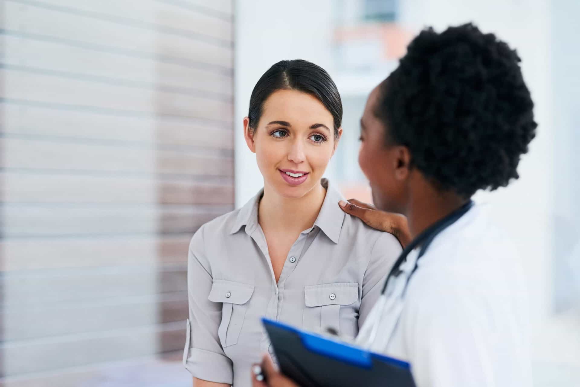 A woman discusses options for insurance with her doctor and asks about rehabs that take Tufts health insurance.