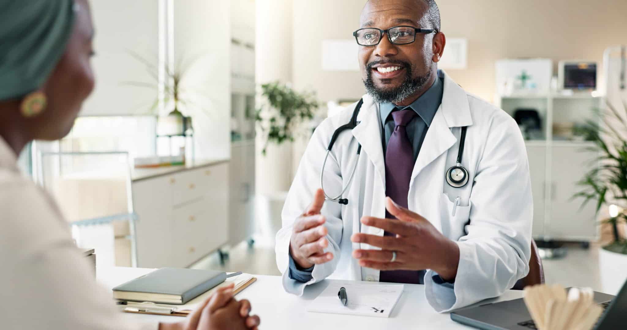 A woman discusses treatment options with her doctor and asks about rehabs that take MassHealth insurance.