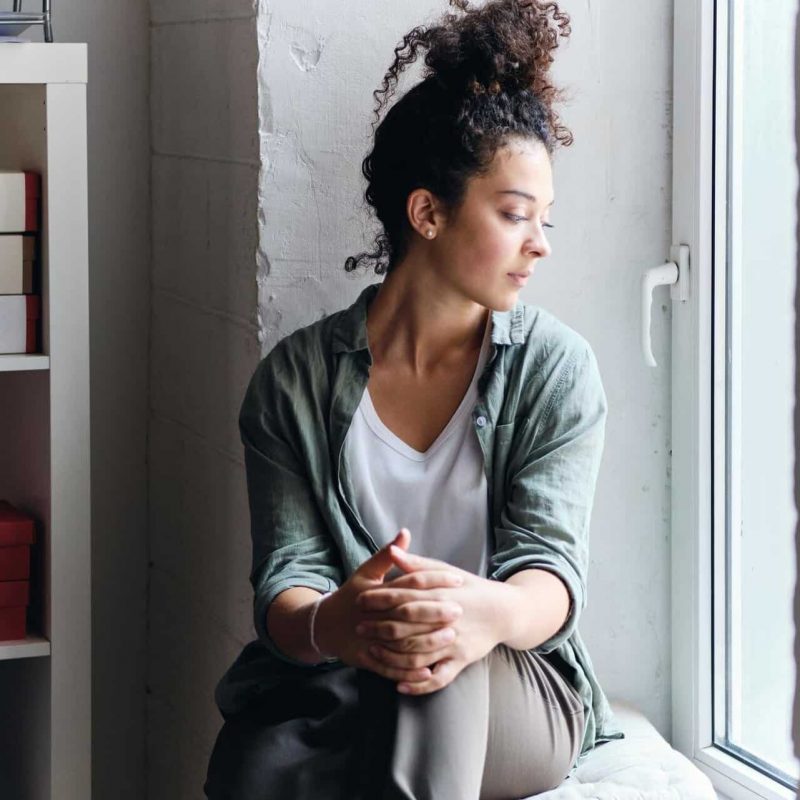 Young pensive woman with a Co-Occurring Disorder